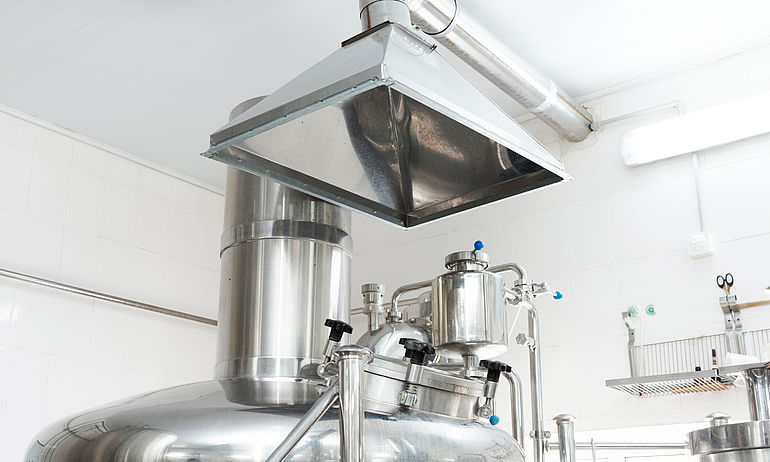 06-beverages large metal boiler for beverage production with exhaust hood