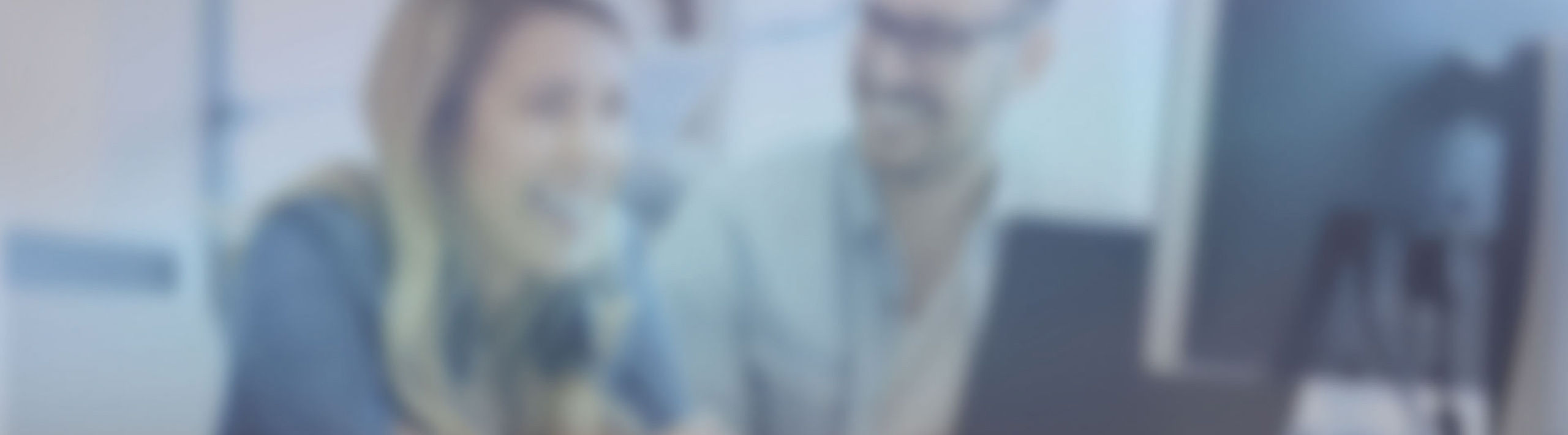 supplier portal_applications_header smiling persons sitting side by side