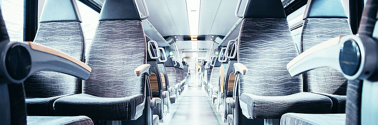 Interior view ICE train passenger compartment with rows of seats
