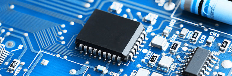 detail view blue cirquit board with black chip