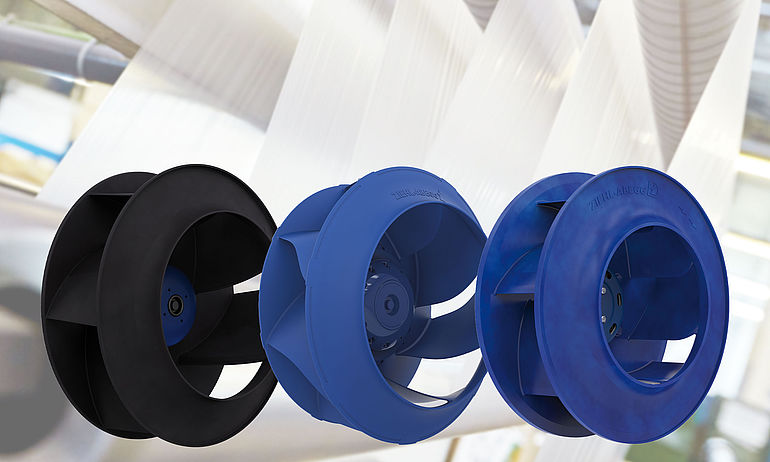 5_packaging and production machine three centrifugal fans in a row black Vpro blue ZAvblue and Cpro ZAmid with packaging machine in the background