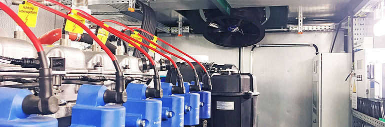 electricity generator with ZIEHL-ABEGG axial fan ZAplus ECblue in the background