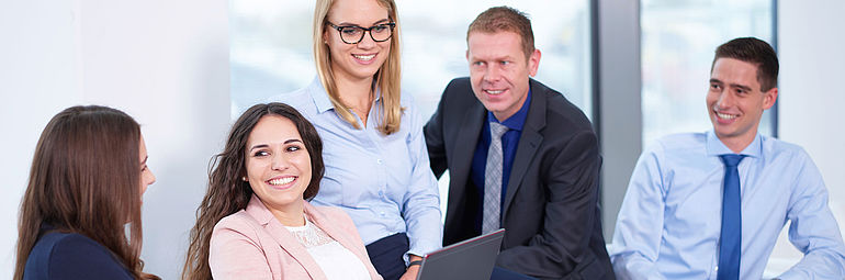 Career beginners and experienced ZIEHL-ABEGG employers on a table
