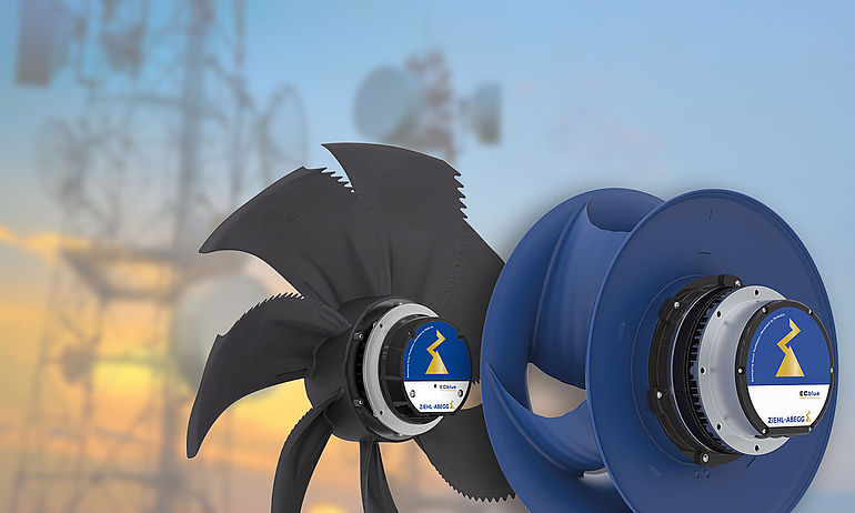black axial fan FE2owlet ECblue and blue centrifugal fan ZAbluefin with transmission tower in the background