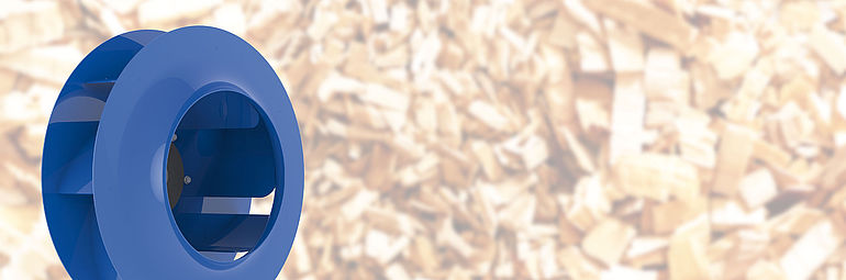 blue centrifugal fan Cpro with wood chips in the background