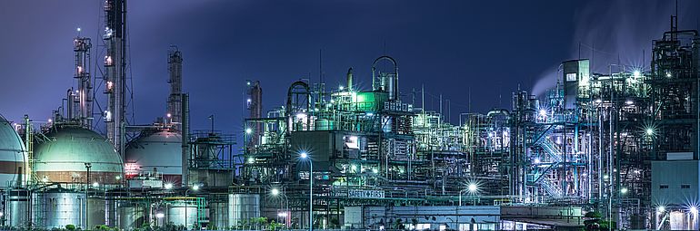 Illuminated oil refinery at night