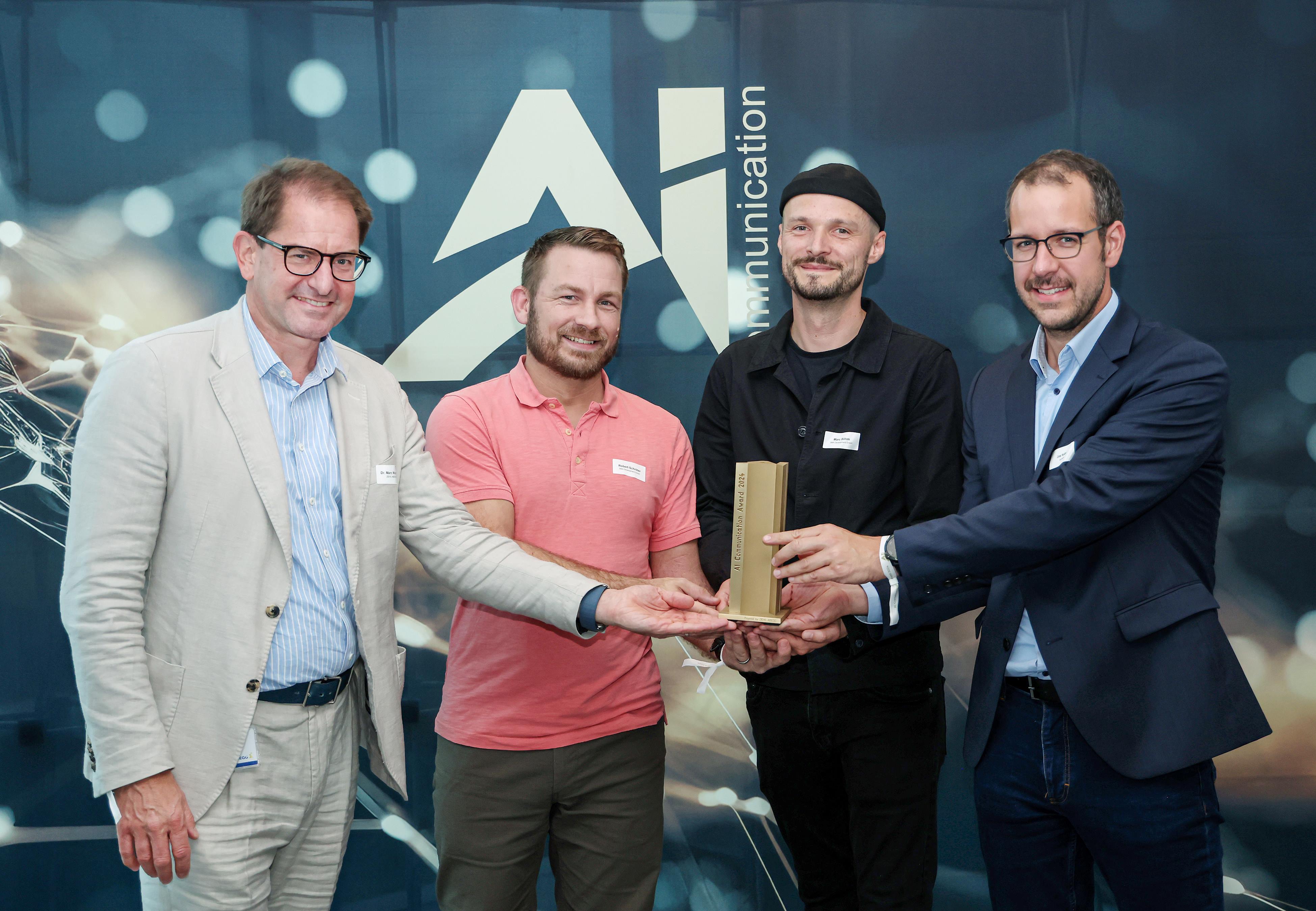 Dr. Marc Wucherer, Robert Schröter and Marc Böhm with the award, Johannes Keller