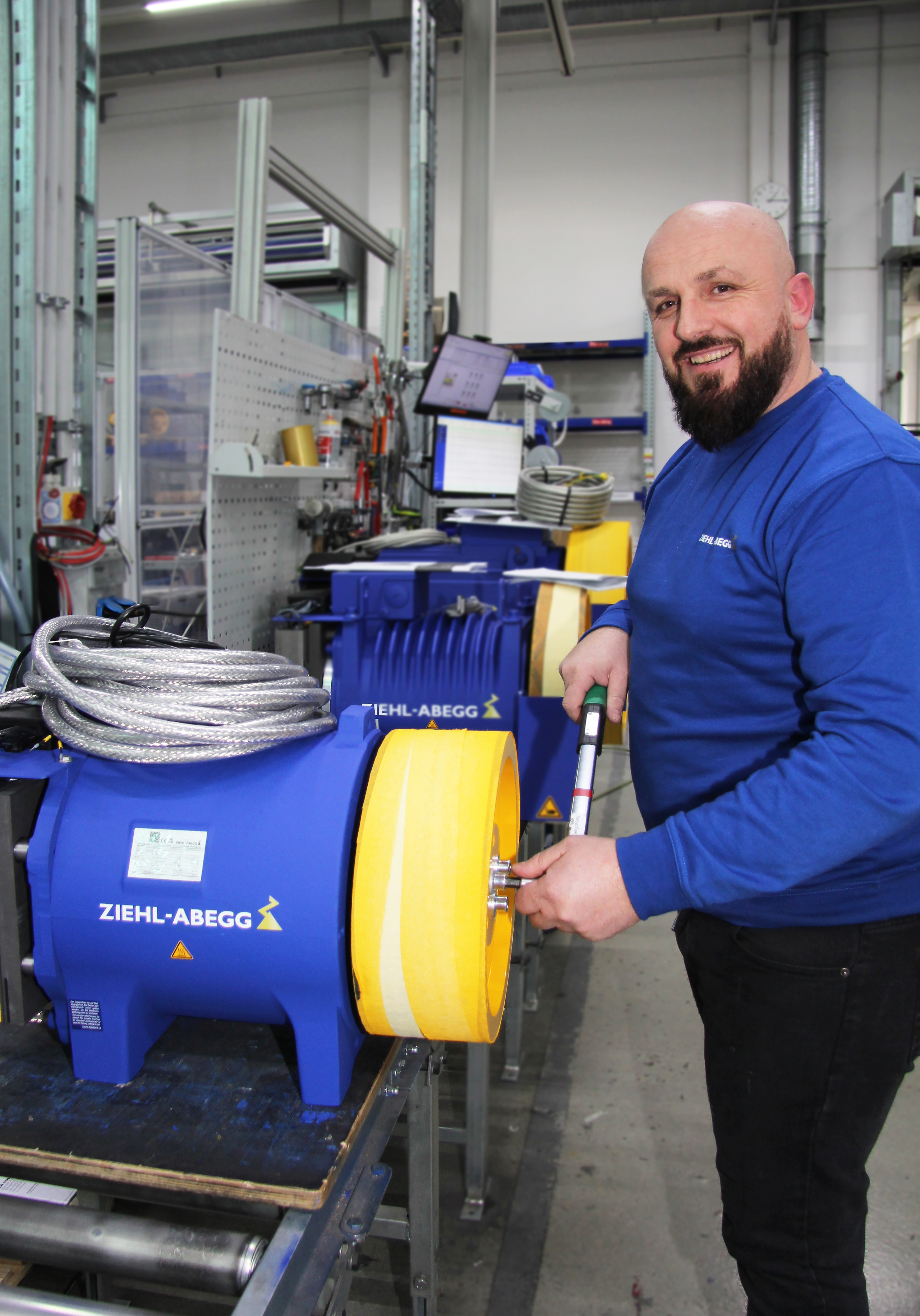 Artan Shahini is mounting the traction sheave onto an elevator motor that is currently still produced using rare-earth magnets. This year, Ziehl-Abegg will start serial production of its world-first innovation: elevator motors equipped with ferrite magnets.